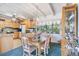 Kitchen with light wood cabinets, a glass dining table and built-in shelving at 1000 Strand Ave., North Myrtle Beach, SC 29582