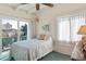 Bright bedroom with a double bed, window, and city view at 1000 Strand Ave., North Myrtle Beach, SC 29582