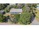 Aerial view of a house nestled among lush green trees at 1000 Strand Ave., North Myrtle Beach, SC 29582