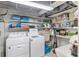 Basement laundry room with washer, dryer, and shelving at 1000 Strand Ave., North Myrtle Beach, SC 29582