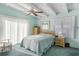 Light and airy bedroom with a ceiling fan and access to a balcony at 1000 Strand Ave., North Myrtle Beach, SC 29582