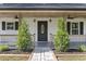 Inviting front entrance with a covered porch and landscaping at 1031 Fowler Rd., Conway, SC 29526