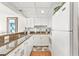 White kitchen with granite countertops and stainless steel appliances at 202 74Th Ave. N # 1249/50, Myrtle Beach, SC 29572