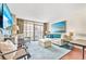 Living room with light sofa, ottoman, and ocean view at 202 74Th Ave. N # 1249/50, Myrtle Beach, SC 29572