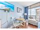 Small dining area with table and chairs, offering ocean views at 202 74Th Ave. N # 1249/50, Myrtle Beach, SC 29572