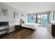 Bright bedroom with a comfortable bed and sliding doors leading to a balcony at 1600 S Ocean Blvd. # 114, Myrtle Beach, SC 29577