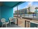Balcony with seating area overlooking the pool and parking lot at 1600 S Ocean Blvd. # 114, Myrtle Beach, SC 29577
