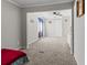 Spacious bedroom with carpeted floor and large window at 1210 John St., Mullins, SC 29574