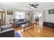 Spacious living room with hardwood floors, view into kitchen and dining area at 1210 John St., Mullins, SC 29574