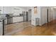 Kitchen with stainless steel appliances and hardwood floors at 1210 John St., Mullins, SC 29574