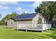 Gray house with a deck and a large backyard at 1210 John St., Mullins, SC 29574