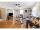 Bright living room with hardwood floors, comfy seating, and large windows at 1210 John St., Mullins, SC 29574