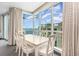 Bright dining room with ocean view and white table at 107 S Ocean Blvd. # 1908, Myrtle Beach, SC 29577