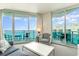 Bright living room with ocean views and access to a balcony at 107 S Ocean Blvd. # 1908, Myrtle Beach, SC 29577