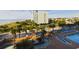 Resort-style pool with waterslide and lounge chairs at 6900 N Ocean Blvd. # 410, Myrtle Beach, SC 29572