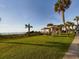 Relaxing beachfront lawn with picnic tables and pergola at 6900 N Ocean Blvd. # 410, Myrtle Beach, SC 29572