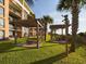 Picnic tables under a pergola on resort grounds at 6900 N Ocean Blvd. # 410, Myrtle Beach, SC 29572