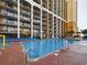 Large resort-style pool with plenty of lounge chairs at 6900 N Ocean Blvd. # 410, Myrtle Beach, SC 29572