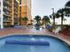 Resort pools with lounge chairs at 6900 N Ocean Blvd. # 410, Myrtle Beach, SC 29572
