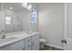 Clean bathroom with double vanity, a large mirror, and a glass shower at 3030 Deerberry Place, Longs, SC 29568