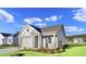 Two-story house with gray siding and a front porch at 3030 Deerberry Place, Longs, SC 29568