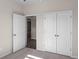 Spacious bedroom with double doors leading to another room and a large closet at 3042 Deerberry Place, Longs, SC 29568