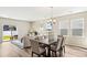 Bright dining room with hardwood floors and access to back patio at 3042 Deerberry Place, Longs, SC 29568