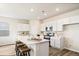 Modern kitchen with white cabinets, breakfast bar and stainless steel appliances at 3042 Deerberry Place, Longs, SC 29568