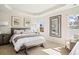 Spacious main bedroom with large mirror and plenty of natural light at 3042 Deerberry Place, Longs, SC 29568