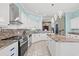 Spacious kitchen featuring granite countertops, stainless steel appliances, and light blue cabinets at 3712 Faith Dr., Conway, SC 29527