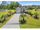 Beautiful home with a long driveway and lush landscaping at 3712 Faith Dr., Conway, SC 29527