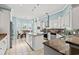 Modern kitchen with white cabinets, granite counters, and an island at 3712 Faith Dr., Conway, SC 29527