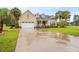 Two-story home with a three-car garage and landscaped yard at 3712 Faith Dr., Conway, SC 29527