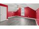 Spacious bedroom with red walls and hardwood floors at 3712 Faith Dr., Conway, SC 29527