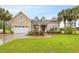 Beautiful house exterior with well-maintained landscaping and a two car garage at 3712 Faith Dr., Conway, SC 29527