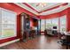 Home office with built-in shelving and hardwood floors at 3712 Faith Dr., Conway, SC 29527