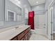 Bathroom with a tub/shower combo, vanity with marble top, and red curtain at 3712 Faith Dr., Conway, SC 29527