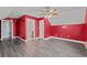 Red walls and grey flooring in this bedroom with ensuite bathroom at 3712 Faith Dr., Conway, SC 29527