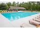 Community pool with lounge chairs and a pavilion at 5039 Whitsett St., Murrells Inlet, SC 29576