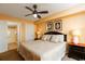 King-size bed, ceiling fan, and en-suite bathroom at 1903 S Ocean Blvd. S # 708, North Myrtle Beach, SC 29582