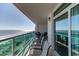 Spacious balcony boasting stunning ocean views, outdoor seating, and glass sliders at 1903 S Ocean Blvd. S # 708, North Myrtle Beach, SC 29582