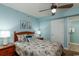 Queen-size bed, ceiling fan, and ocean decor at 1903 S Ocean Blvd. S # 708, North Myrtle Beach, SC 29582
