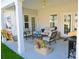 Relaxing patio with seating area, swing, and grill at 2013 Great Blue Heron Dr., Little River, SC 29566