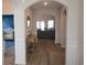 Bright entryway with hardwood floors, leading to living room at 2013 Great Blue Heron Dr., Little River, SC 29566