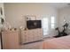 Main bedroom featuring a dresser, TV, and access to the bathroom at 2013 Great Blue Heron Dr., Little River, SC 29566