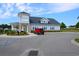 Community center with ample parking and welcoming entrance at 2013 Great Blue Heron Dr., Little River, SC 29566