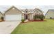 House exterior with a two-car garage and well-manicured lawn at 333 Carolina Springs Ct., Conway, SC 29527