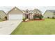 House exterior featuring a two-car garage and well-maintained lawn at 333 Carolina Springs Ct., Conway, SC 29527