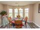 Bright dining area with wood table and chairs, overlooking a grassy backyard at 333 Carolina Springs Ct., Conway, SC 29527
