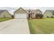 House exterior with a two-car garage and well-manicured lawn at 333 Carolina Springs Ct., Conway, SC 29527